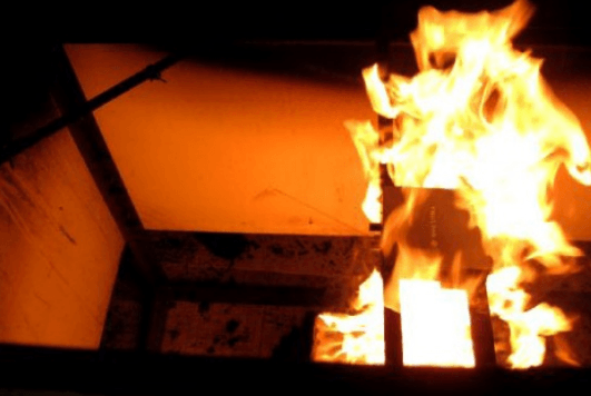 Image of a plenum audio amplifier on fire;